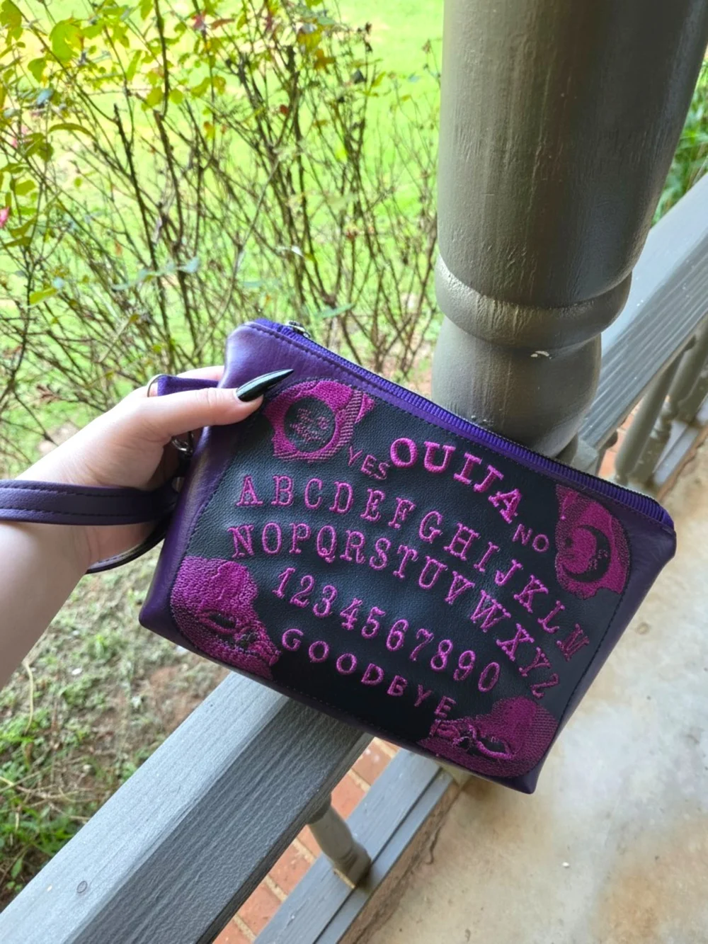 Asylum Handicrafts compact wristlet